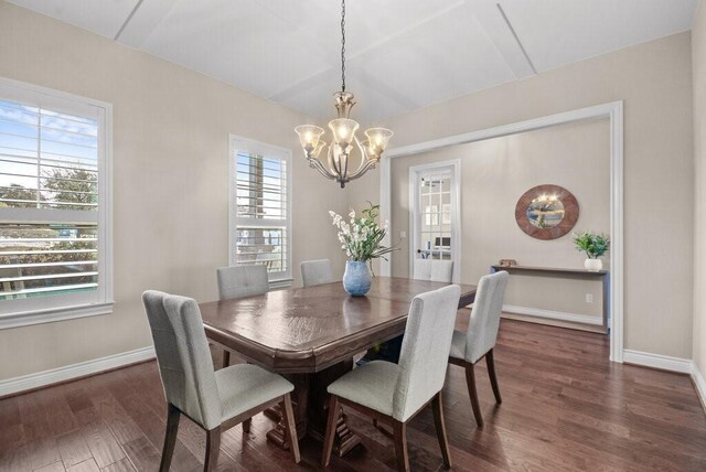 dining room featuring plenty of natural light, a chandelier, and dark hardwood / wood-style floors