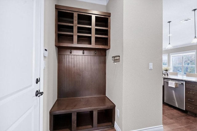 mudroom with dark hardwood / wood-style flooring and ornamental molding