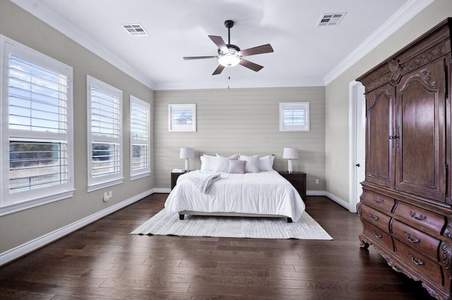 bedroom with dark hardwood / wood-style floors, ceiling fan, and ornamental molding