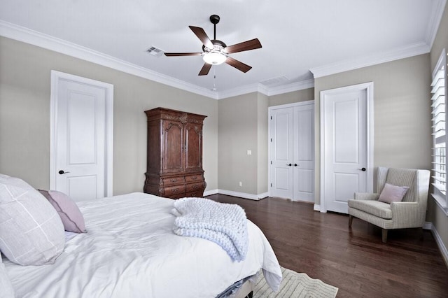 bedroom featuring ornamental molding, ceiling fan, and dark wood-type flooring