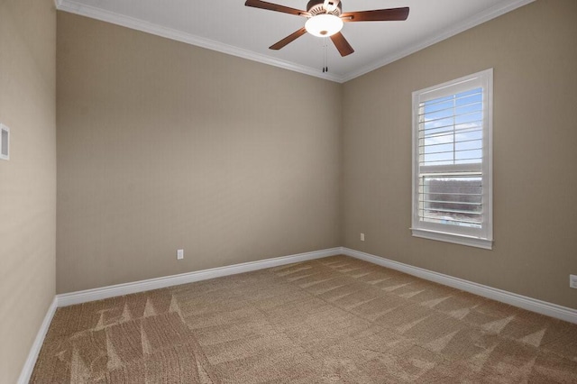 spare room featuring carpet flooring, ceiling fan, and crown molding