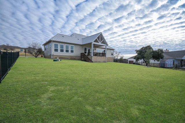 back of property featuring a lawn