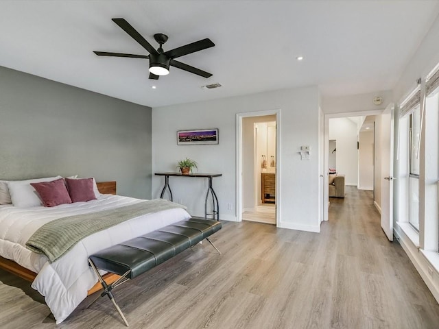 bedroom with ceiling fan and light wood-type flooring