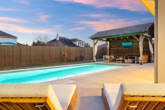 view of swimming pool with a patio area and an outdoor hangout area