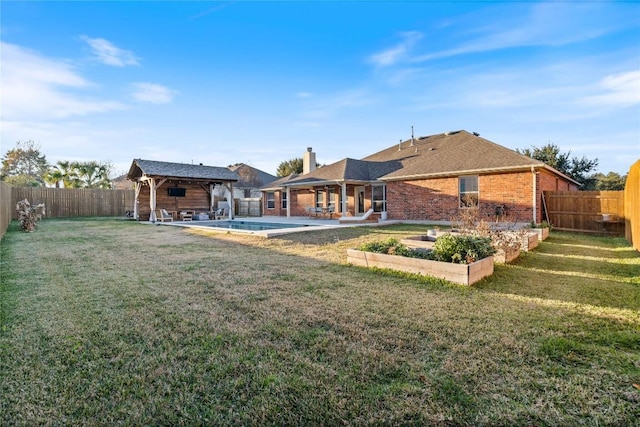 view of yard featuring a gazebo and a patio area