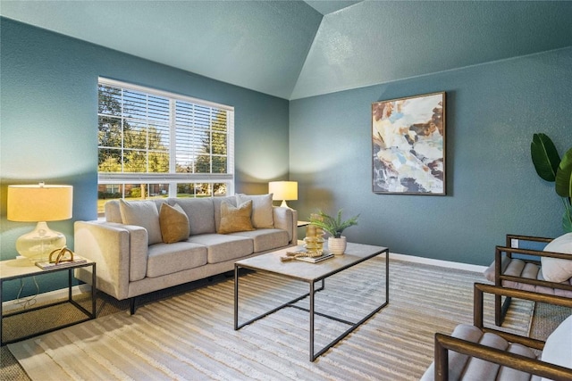 living room with lofted ceiling