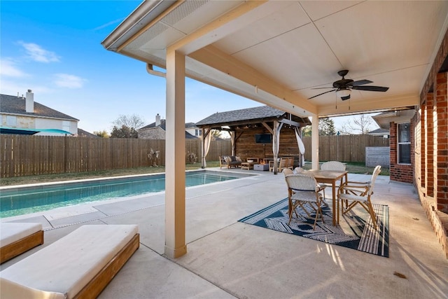 view of pool with a gazebo, ceiling fan, and a patio area