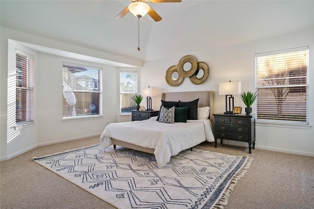 carpeted bedroom featuring ceiling fan and vaulted ceiling