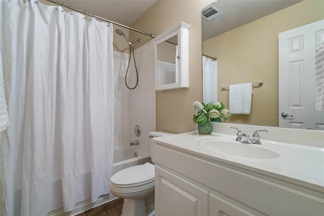 full bathroom featuring vanity, shower / bath combo, and toilet