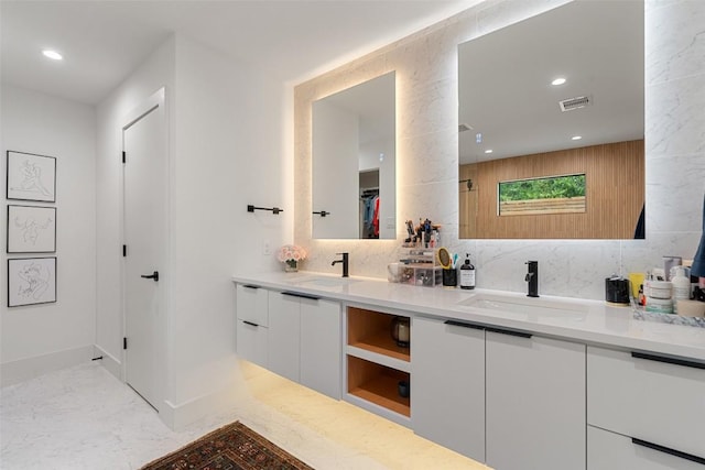 bathroom featuring tasteful backsplash and vanity