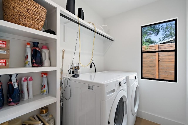 clothes washing area featuring washing machine and dryer