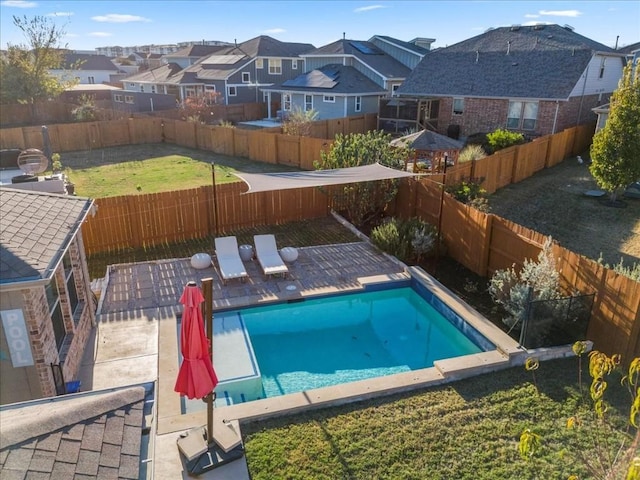 view of pool with a yard and a patio