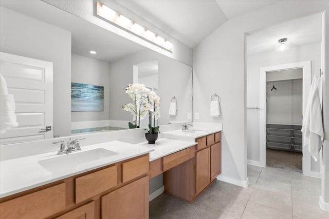 bathroom with tile patterned floors and vanity