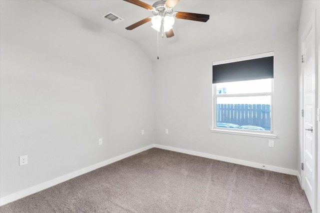 empty room with ceiling fan, carpet, and lofted ceiling