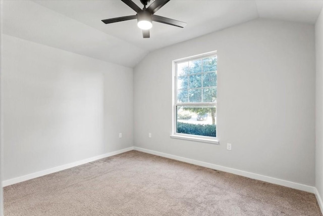 spare room with carpet, ceiling fan, and lofted ceiling