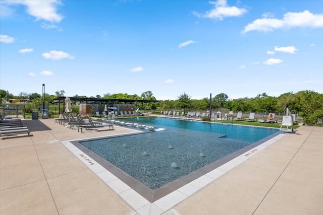 view of swimming pool featuring a patio area