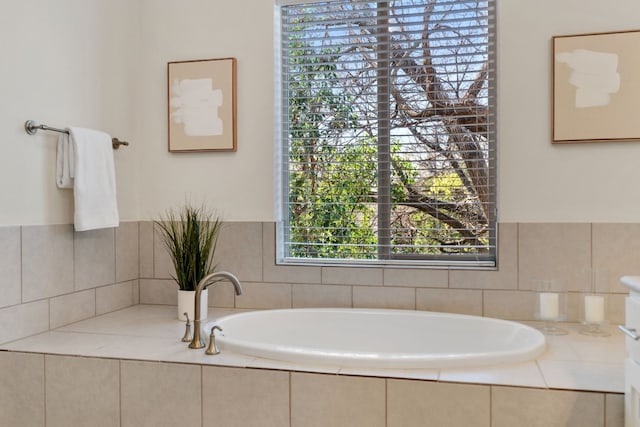 bathroom featuring tiled bath