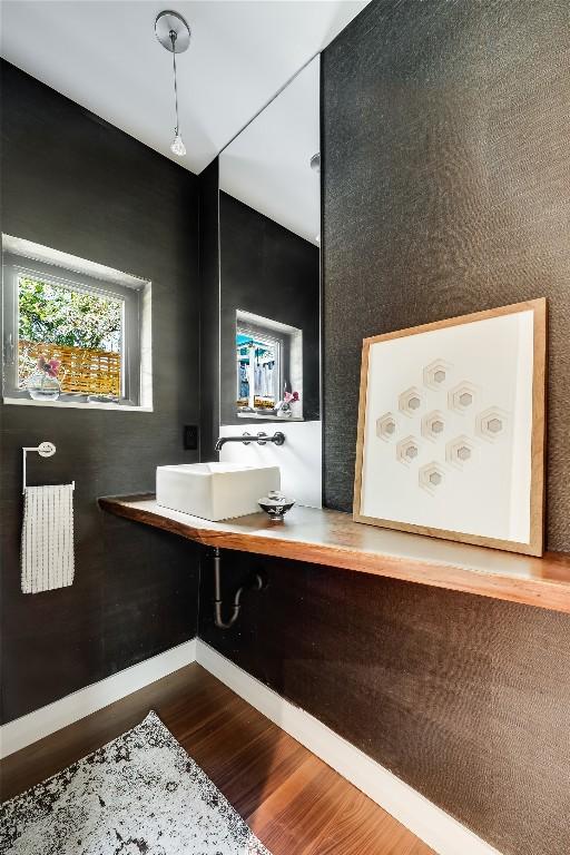 bathroom with sink and hardwood / wood-style flooring