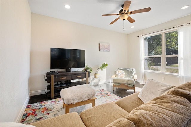 living area featuring recessed lighting, ceiling fan, baseboards, and wood finished floors