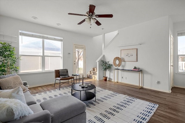 living room with ceiling fan and hardwood / wood-style flooring