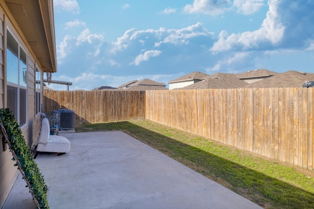 12110 Riprap Dr, Manor, TX 78653 - fenced backyard featuring a patio area and cooling unit