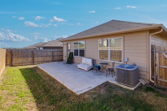 12110 Riprap Dr, Manor, TX 78653 - rear view of house with central AC unit and a patio