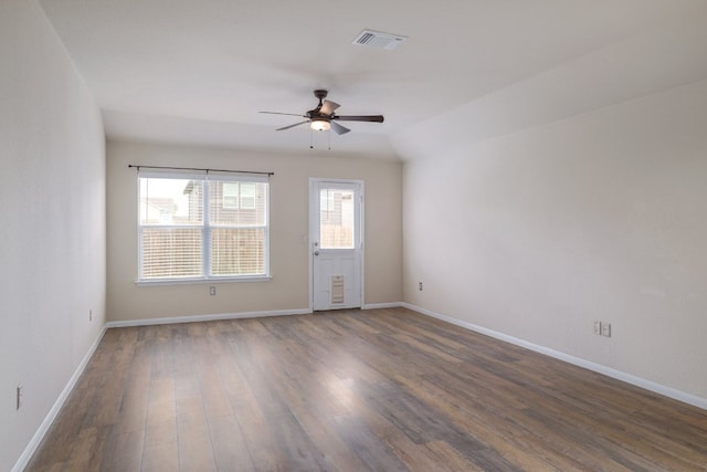 12110 Riprap Dr, Manor, TX 78653 - empty room featuring a ceiling fan, dark wood-type flooring, and baseboards