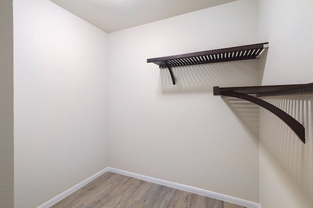 12110 Riprap Dr, Manor, TX 78653 - walk in closet featuring wood finished floors