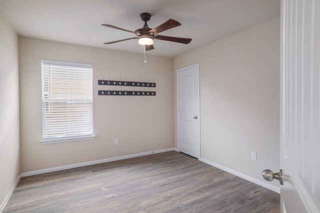 12110 Riprap Dr, Manor, TX 78653 - empty room with a ceiling fan, wood finished floors, and baseboards
