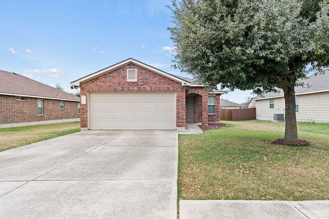 view of front of property featuring a front yard and a garage