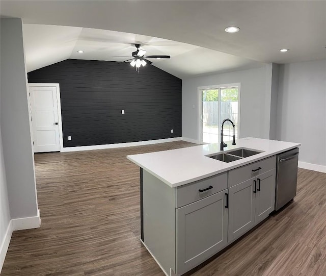 kitchen with dark hardwood / wood-style flooring, ceiling fan, sink, a center island with sink, and dishwasher