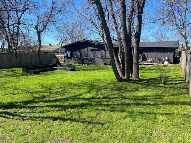 view of yard with central AC unit