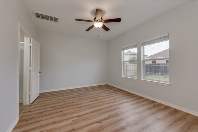 unfurnished room with light hardwood / wood-style flooring and ceiling fan