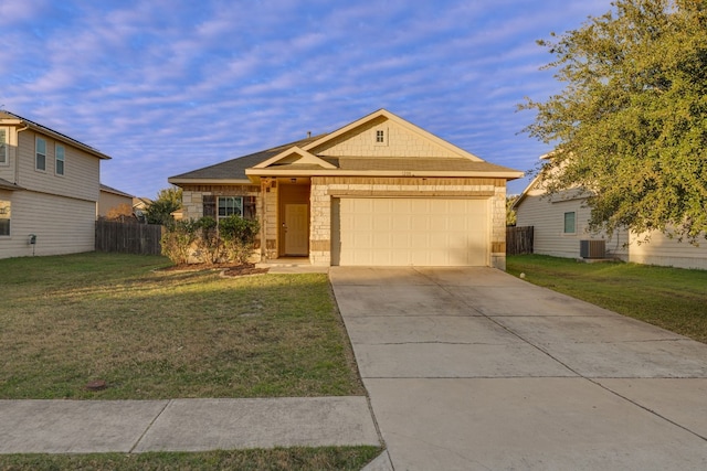 view of front facade with central AC, a front yard, and a garage