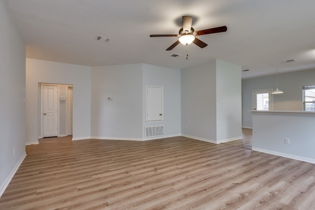 spare room featuring light wood-type flooring and ceiling fan