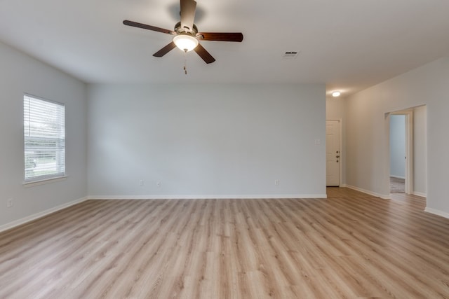 unfurnished room featuring light hardwood / wood-style flooring and ceiling fan