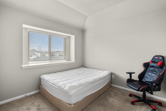 carpeted bedroom featuring lofted ceiling