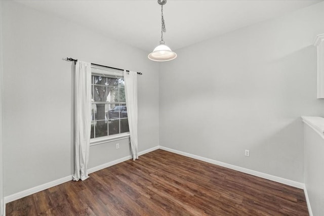 unfurnished dining area with dark hardwood / wood-style flooring