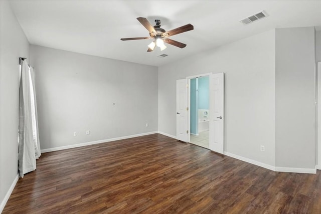 unfurnished room with dark hardwood / wood-style floors and ceiling fan