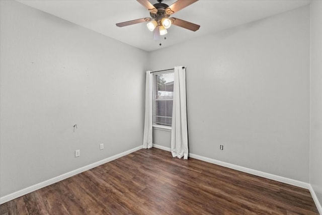 unfurnished room featuring ceiling fan and dark wood-type flooring