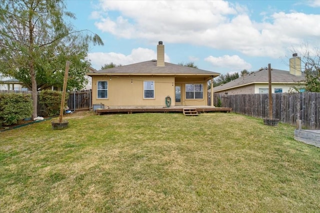 rear view of house with a lawn