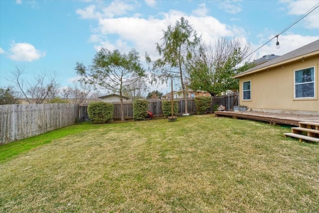 view of yard with a wooden deck