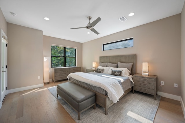 bedroom with ceiling fan and light wood-type flooring