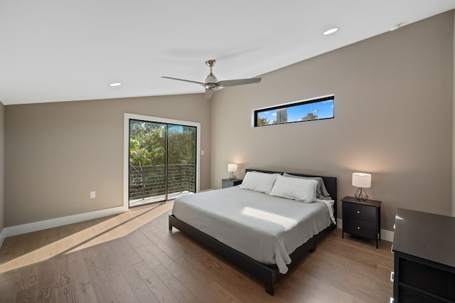 bedroom featuring access to exterior, hardwood / wood-style floors, vaulted ceiling, and ceiling fan