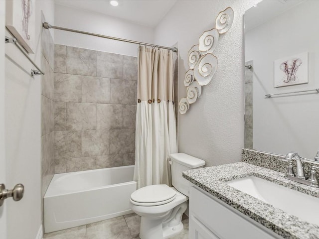 full bathroom featuring tile patterned flooring, shower / bath combination with curtain, vanity, and toilet