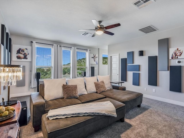 living room with ceiling fan and carpet floors