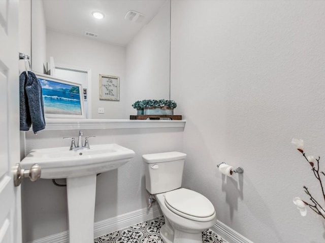 bathroom with sink, tile patterned floors, and toilet