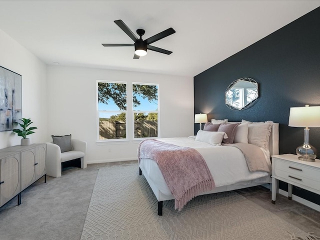 carpeted bedroom featuring ceiling fan