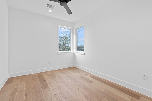 empty room with ceiling fan and light wood-type flooring