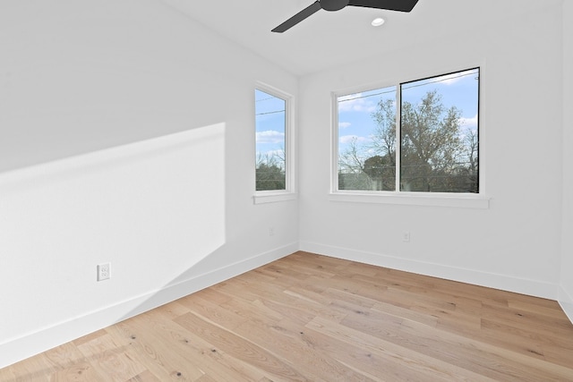 spare room with ceiling fan and light hardwood / wood-style flooring